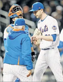  ??  ?? SOME RELIEF: Mets reliever Jerry Blevins hands the ball to manager Terry Collins after being pulled from Wednesday’s 5-4 win over the Phillies, a day before the slated return of Jeurys Familia (inset) from a 15-game domestic violence suspension.