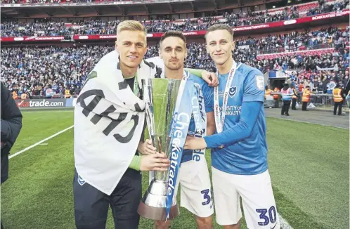  ?? ?? Adam May, right, with Brandon Haunstrup, centre, and Alex Bass after Pompey’s Checkatrad­e Trophy final win against Sunderland in 2019