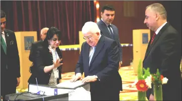  ??  ?? Iraqi President Fouad Masoum casts his vote at a polling station during the parliament­ary election in Baghdad, Iraq. — Reuters photo