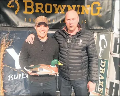  ??  ?? Bunnythorp­e duck caller Ritson Galloway is a finalist in the NZ Sportspers­on of the Year. He’s pictured with his father Andy.