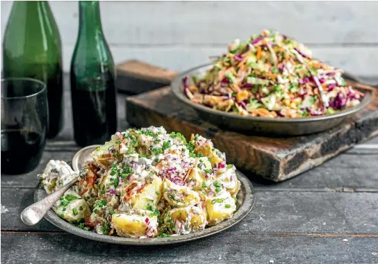  ??  ?? This loaded potato salad and perfect barbecue slaw will have your friends and family eager for more get-togethers over the summer months.
