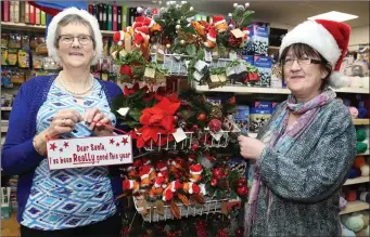  ??  ?? At The Forge Josie Lehane and Ann Keller are telling Santa that they have been really good this year!.