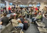  ?? ?? A crowded lounge at Miami’s airport