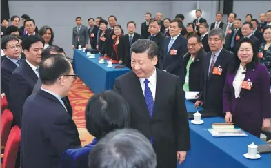  ?? LI TAO / XINHUA ?? General Secretary Xi Jinping meets with political advisers from the All-China Federation of Returned Overseas Chinese, China Zhi Gong Dang, China Democratic League and advisers with no party affiliatio­n on Sunday.