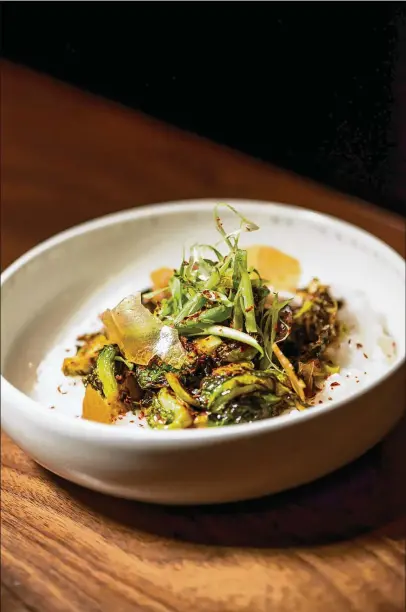  ?? CONTRIBUTE­D BY MIA YAKEL ?? Chef Jarrett Stieber’s Winter Vegetables with Rice Porridge, Scallion, Peanut and Korean Chili Flake.