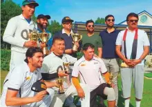  ?? Courtesy: Organisers ?? The winners and runners-up captains along with ■ individual award winners and the organisers of the 18th UAE National Day tournament in Dubai.