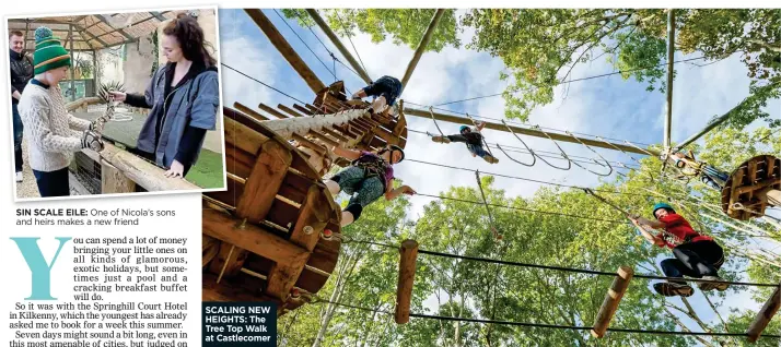  ??  ?? SIN SCALE EILE: One of Nicola’s sons and heirs makes a new friend SCALING NEW HEIGHTS: The Tree Top Walk at Castlecome­r