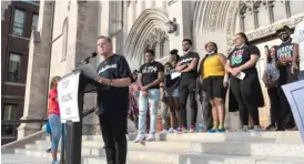  ??  ?? ABOVE: The Rev. Michael Pfleger speaks Thursday at an anti-violence rally at St. Sabina. TOP: Hundreds march on the South Side demanding the end of police and gun violence.