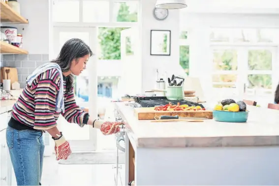  ?? ?? 10'000 Hours/Getty Images Kitchen islands that are inclusive of their owners' appliances are more on trend, as they free up essential counter space.