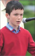  ??  ?? Tomás Cronin delivers a poetry recitation at the Rathcoole Commemorat­ion.