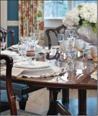  ?? (Handout/TNS) ?? An enchanting neutral tabletop lets the beauty of the dining room take center stage.