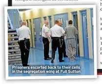  ?? ?? Prisoners escorted back to their cells in the segregatio­n wing at Full Sutton