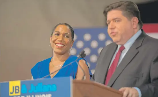  ?? MAX HERMAN/FOR THE
SUN-TIMES ?? State Rep. Juliana Stratton looks on as J.B. Pritzker announces her as his running mate on Aug. 10, 2017.