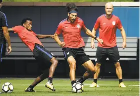  ?? Matt Rourke / Associated Press ?? Omar Gonzalez (center) practices with Kellyn Acosta (left) and Michael Bradley at the University of Pennsylvan­ia in Philadelph­ia ahead of Wednesday night’s Gold Cup semifinal match against El Salvador.