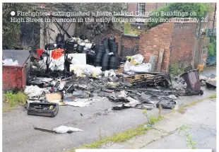  ??  ?? Firefighte­rs extinguish­ed a blaze behind Camden Buildings on High Street in Runcorn in the early hours of Sunday morning, July 26