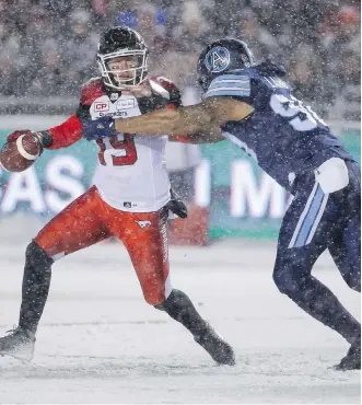  ?? ANDRE RINGUETTE/GETTY IMAGES ?? Quarterbac­k Bo Levi Mitchell of the Calgary Stampeders handled the elements well with 373 yards passing and two touchdowns but it was his last-minute intercepti­on that snuffed out any hope of the Stamps winning the Grey Cuy Sunday in Ottawa.