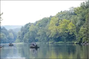  ?? NWA Democrat-Gazette file photograph by Flip Putthoff ?? Anglers fish along the White River below Beaver Dam, also called the Beaver tailwater, in August 2019. The river is refreshing and cold during summer because water released through the dam comes from deep down in Beaver Lake.