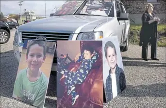  ??  ?? Photos of 6-year-old Julian Hoffman, who was shot by his 10-year-old brother with Kayleigh Potter's gun, rest against a vehicle at Ms. Potter's preliminar­y hearing in 2017.