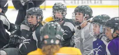  ?? JASON MALLOY/THE GUARDIAN ?? UPEI Panthers listen to coach Bruce Donaldson explain a drill during Tuesday’s practice.