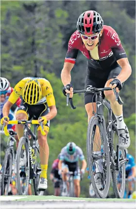  ??  ?? On the up: Geraint Thomas heads Julian Alaphilipp­e on the final climb