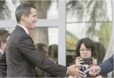  ?? — AFP ?? Juan Guaido greets people upon arrival at the European Union headquarte­rs in Brasilia on Thursday.