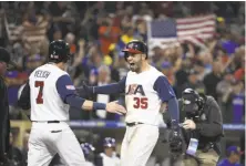  ?? Denis Poroy / Getty Images ?? Eric Hosmer (right) gets American flags waving as he celebrates his two-run home run in eighth inning in San Diego.