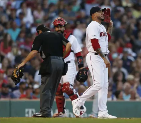  ?? ASSOCIATED PRESS ?? DOWNER: Reliever Hector Velazquez walks away during the seventh inning of yesterday’s loss to the Angels.