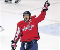  ?? AP PHOTO ?? Washington Capitals forward Alex Ovechkin celebrates his game-winning goal during overtime of an NHL game against the Anaheim Ducks in Washington on Dec. 16, 2017.