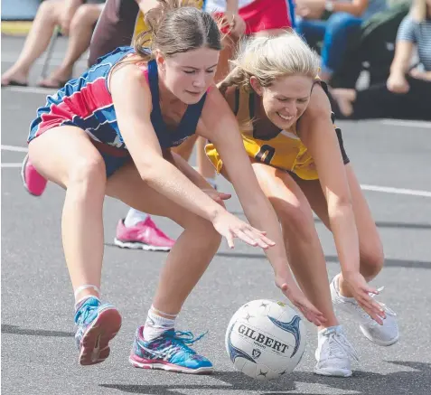  ??  ?? BATTLE: Kaitlin Gladman (Queensclif­f) and Hannah Kennedy (Drysdale) scrap for the ball on Saturday. Pictures: PETER RISTEVSKI