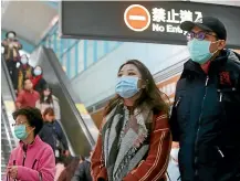  ?? CHIANG YING-YING/AP ?? Almost a week after the outbreak of the disease Auckland and Christchur­ch Internatio­nal Airports finally had a public health nurse available to take the temperatur­es of incoming passengers from flights from China who felt unwell.