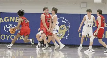  ??  ?? Blackhawk senior Mike Ericson, No. 42, blocks Goblin defenders from junior Korbyn Mobley, No. 24, who pushes in with the ball during the game Friday, Jan. 29, in Harrison against the Goblins.