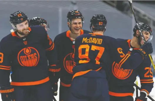  ?? IAN KUCERAK ?? Edmonton Oilers' Darnell Nurse, right, and his teammates celebrate his third-period goal in their comeback win over the Winnipeg Jets Saturday at Rogers Place.