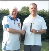  ??  ?? Tenterden coach Alan Haselup presents the wooden spoon to Ray Vince