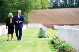  ?? Photograph: Lukas Coch/EPA ?? Lucy and Malcolm Turnbull visit the grave of Lucy Turnbull’s grand uncle Robert Forrest Hughes at Heilly Station cemetery near Amiens, France.