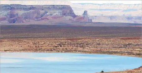  ?? Photograph­s by Keith Schneider For The Times ?? LAKE POWELL boasts the nation’s second-largest reservoir. Its surroundin­g desert community is in the midst of tremendous growth.