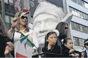  ?? [AP FILE PHOTO] ?? Participan­ts in the Columbus Day Parade ride a float with a large bust of Christophe­r Columbus on Oct. 15, 2015, in New York.