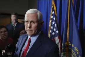  ?? AP PHOTO/STEVEN SENNE ?? Former Vice President Mike Pence faces reporters after making remarks at a GOP fundraisin­g dinner, Thursday, March 16, 2023, in Keene, N.H.