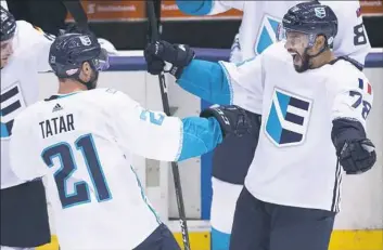  ?? Nathan Denette/Canadian Press via Associated Press ?? Team Europe forward Tomas Tatar celebrates with teammate Pierre-Edouard Bellemare after scoring the winning goal in overtime against Team Sweden in World Cup of Hockey semifinal Sunday in Toronto.