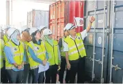  ?? AFP ?? Malaysian Environmen­t Minister Yeo Bee Yin, front second left, leads an inspection of plastic waste containers in Butterwort­h, Malaysia yesterday.