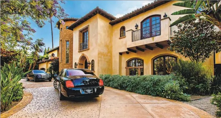  ?? Photograph­s from Keller Williams Realty ?? LISTED FOR $3.799 million, former Dodger Milton Bradley’s home is 7,500 square feet and sits on more than a third of an acre in Encino’s Amestoy Estates area.