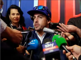  ??  ?? Fernando Alonso, of Spain, answers a question during a press conference for the Indianapol­is 500 IndyCar auto race at Indianapol­is Motor Speedway, on Thursday in Indianapol­is. AP PHOTO