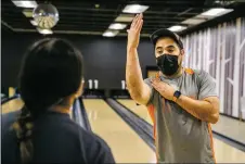  ?? NATHAN BURTON/Taos News ?? Coach Greg Rael instructs a student during practice Monday (Nov. 22) at Gutters Bowling.