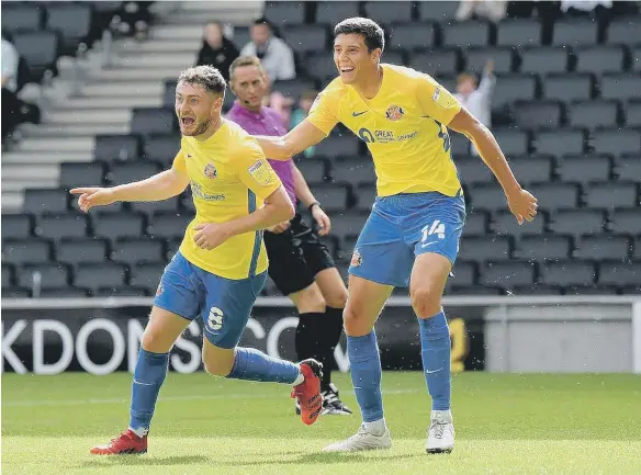  ??  ?? Elliot Embleton and Ross Stewart celebrate Sunderland’s opening goal. Pictures: Frank Reid