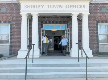  ?? COURTESY TOWN OF SHIRLEY ?? Assistant Town Administra­tor Aubrey Thomas, left, and Assistant Town Accountant Amanda Belliveau held open the doors to the town offices Tuesday morning, when the building reopened to the public after a 4-month shutdown.