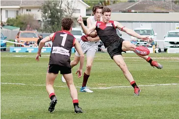  ??  ?? Rhys Galvin gets his kick away just in time against Traralgon, he was named best on ground for the Gulls in their loss in 2019.