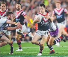  ?? Picture: AAP IMAGE ?? Luke Keary burts past defender.