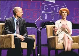  ?? Rich Polk Getty Images for Politicon ?? ATTORNEY Michael Avenatti and comedian Kathy Griffin speak on a panel at Politicon in downtown L.A. about challengin­g President Trump in 2020.
