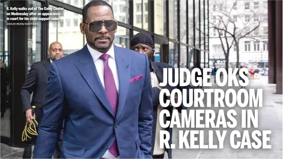  ?? ASHLEE REZIN/SUN-TIMES ?? R. Kelly walks out of The Daley Center on Wednesday after an appearance in court for his child-support case.