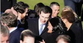  ?? EVAN VUCCI AP ?? Transporta­tion Secretary Pete Buttigieg speaks with Rep. Pramila Jayapal, D-Wash., before the signing of the Infrastruc­ture Investment and Jobs Act on Nov. 15.