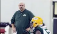  ?? MIKE ROEMER — THE ASSOCIATED PRESS FILE ?? In this file photo, new Green Bay Packers defensive coordinato­r Mike Pettine watches linebacker Oren Burks work out during NFL rookie football camp in Green Bay, Wis. The coaching roots run deep in Pettine’s family.